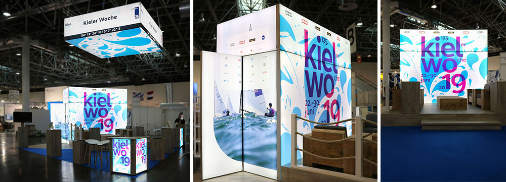 Die 3,50m hohe beleuchtete Messekabine schafft Stauraum und Fernwirkung